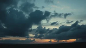 Cinematic wide shot of moody landscape at dusk with dramatic cloud formations and atmospheric lighting, professional film production quality, no text or dialogue visible, emphasizing visual storytelling and emotional tone